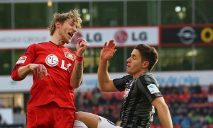 christian-guenter-of-freiburg-challenges-stefan-kiessling-of-during-picture-id464744640